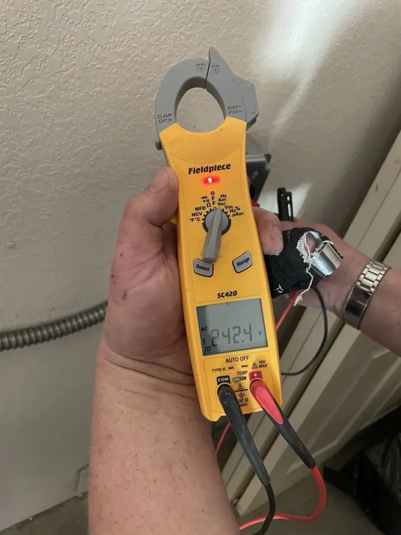 Voltage testing with clamp meter during Whole House Surge Protector in Roslyn